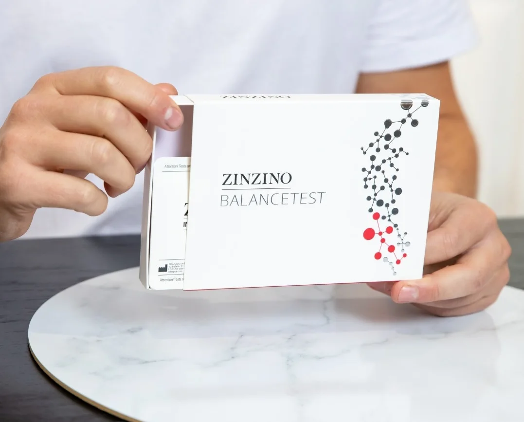 The Zinzino BalanceTest kit, held open in two hands