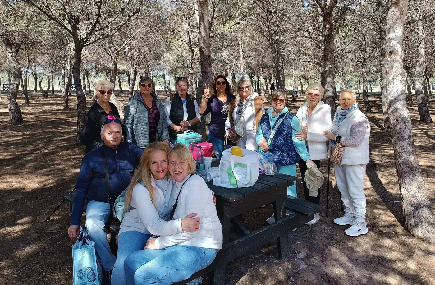 The walking group enjoying a picnic in the pine forest